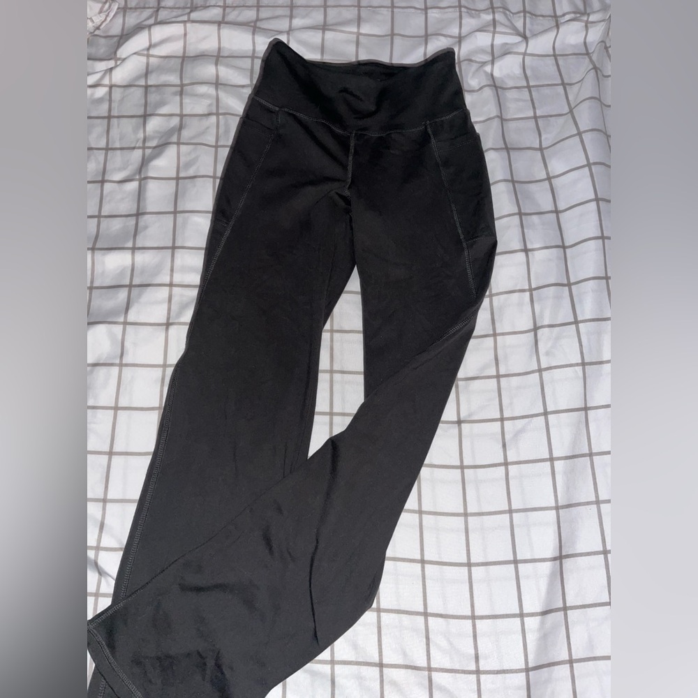 Super tight fit yoga pants with pockets, barely flare at the ends.